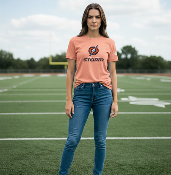 Woman smiling while wearing Columbus Blue Jacket gear