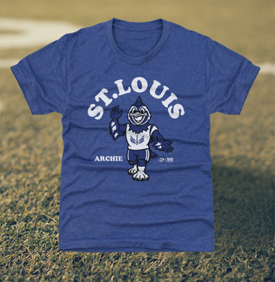 Blue Louisville Kings youth t-shirt featuring a mascot Archie on a grassy field